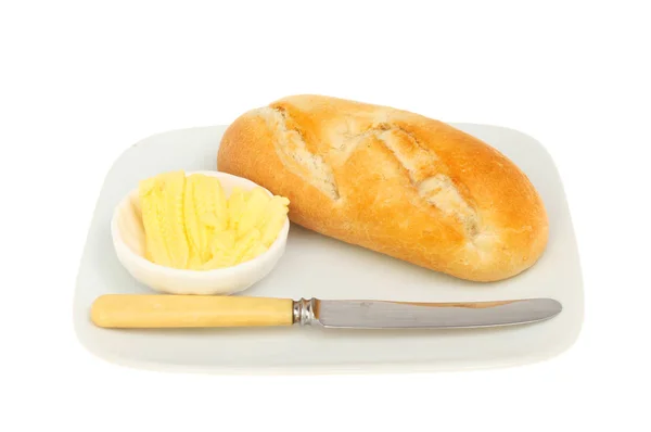 Bread roll knife and butter — Stock Photo, Image