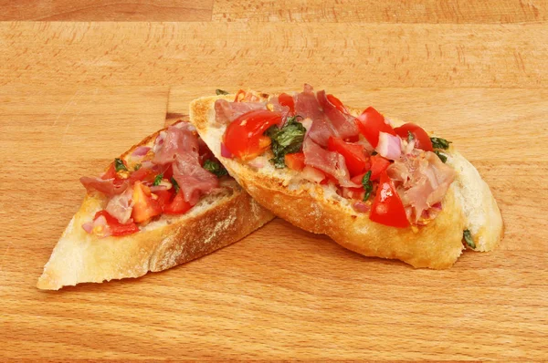 Bruschetta on a chopping board — Stock Photo, Image