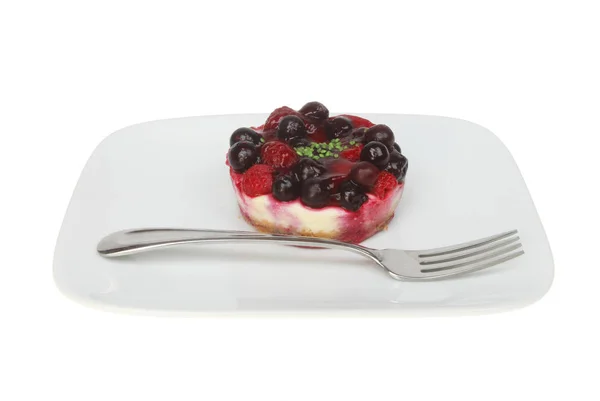 Tvarohový koláč a vidličkou na talíři — Stock fotografie
