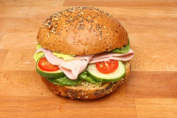 Ham roll on a chopping board — Stock Photo, Image