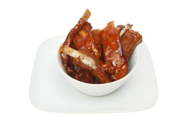 Sticky spare ribs in a bowl Stock Photo