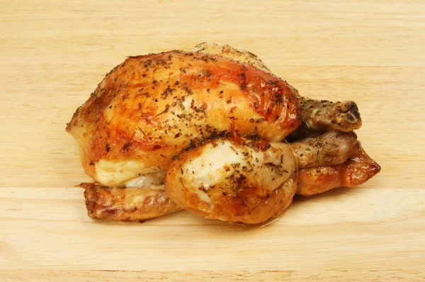 Roasted poussin on a board — Stock Photo, Image
