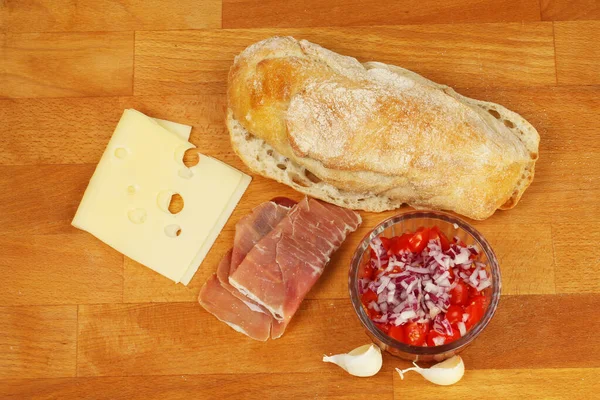 Bruschetta ingredients on a board — Stock Photo, Image
