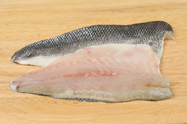 Bass fillets on a board — Stock Photo, Image