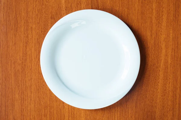 Empty White Plate Wooden Table Top View — ストック写真