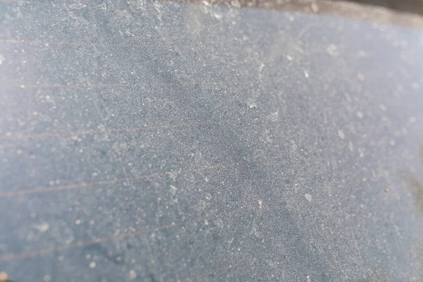 Dust on the glass texture. Dirty and dusty car window glass. Car care clean service or garage concept image