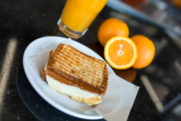 A glass of Orange juice, orange slices and toast sandwich. Healthy Breakfast, Traditional turkish breakfast