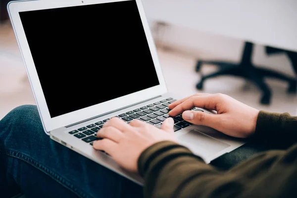 Man working with laptop in office interior. Modern Office Interior working concept image.