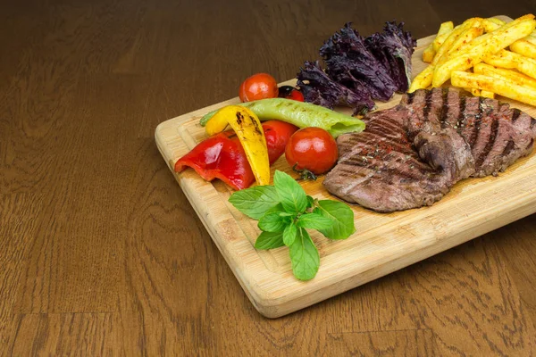 Delicious Grilled Beef Steak French Fries Chips Vegetables Wooden Plate — Stock Photo, Image