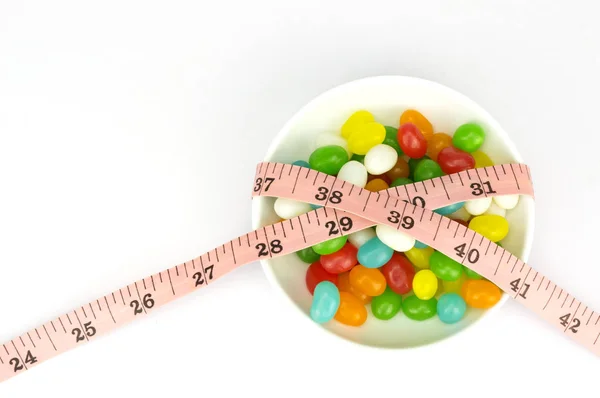Colorful candies and tape measure with shallow depth of field (dof) — Stock Photo, Image