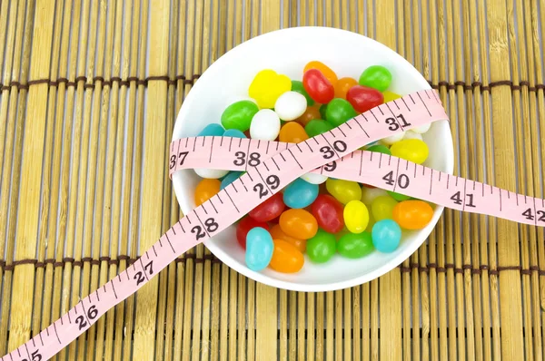 Colorful candies and tape measure with shallow depth of field (dof) — Stock Photo, Image