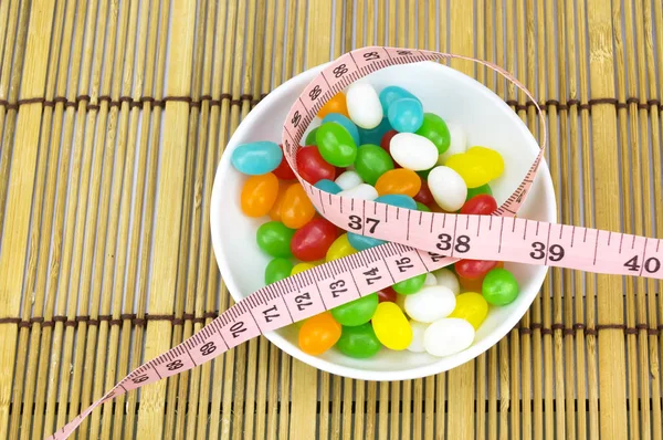 Colorful candies and tape measure with shallow depth of field (dof) — Stock Photo, Image