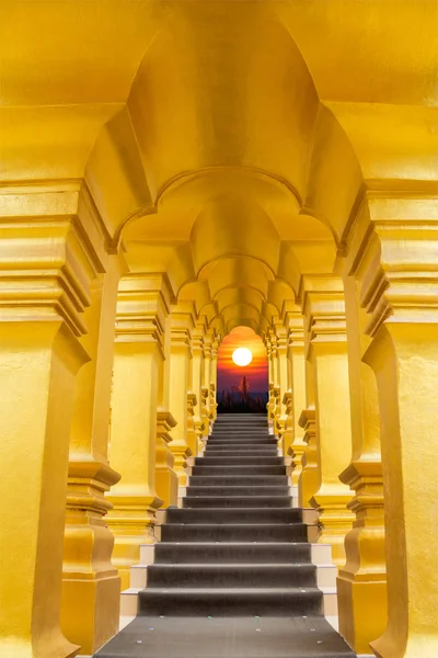 Golden arch over the stair and sunrise background — Stock Photo, Image