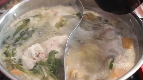 Delicious shabu with egg served in a hot pot style — Stock Video