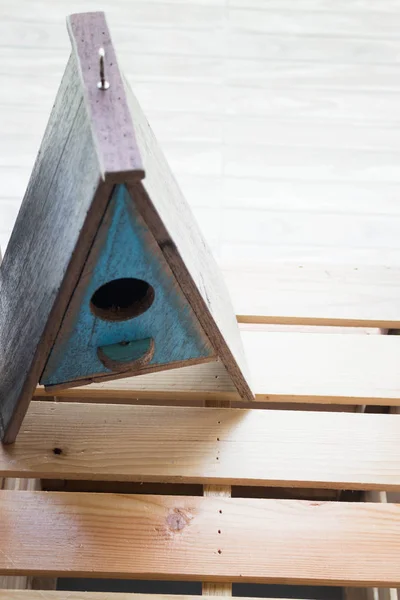 Wooden bird house decorated on the table — Stock Photo, Image