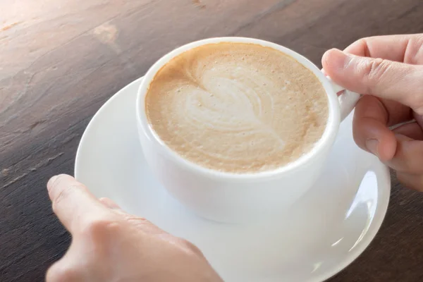 Hot cup of coffee latte — Stock Photo, Image