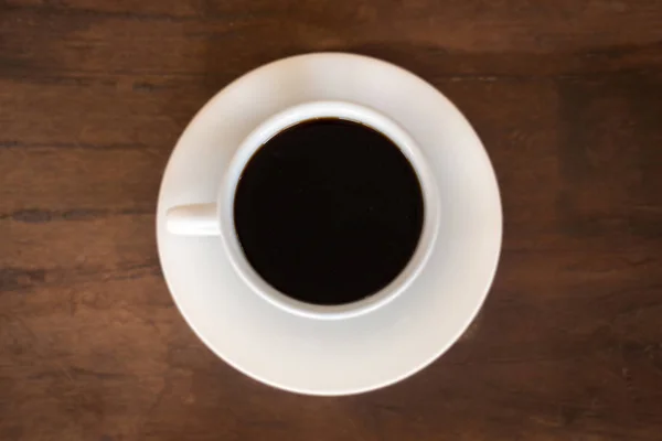 Káva pohár top pohled na dřevěné pozadí stolu — Stock fotografie