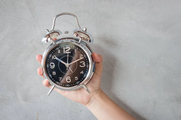 Woman Hand On Alarm Clock — Stock Photo, Image
