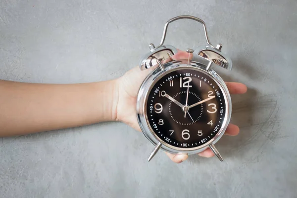 Woman Hand On Alarm Clock — Stock Photo, Image