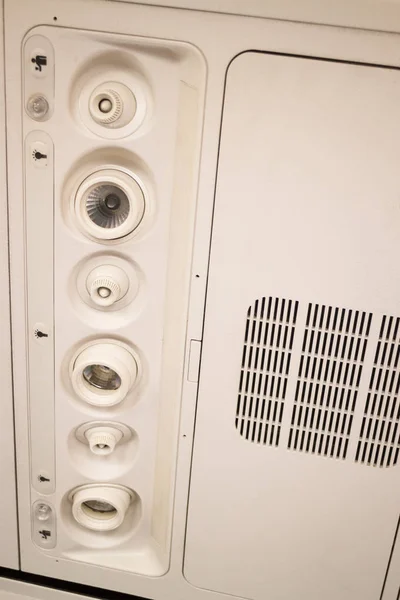 Interior do assento de avião com botão de teto — Fotografia de Stock