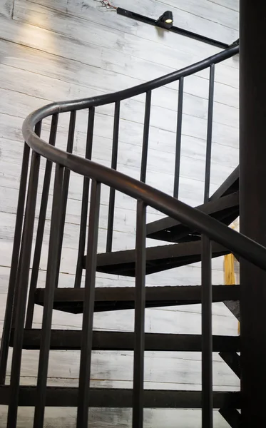 Dark iron metal spiral staircase — Stock Photo, Image