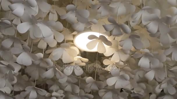 White flower paper hanging from the ceiling Stock Video Footage by  ©nalinrat #162217912