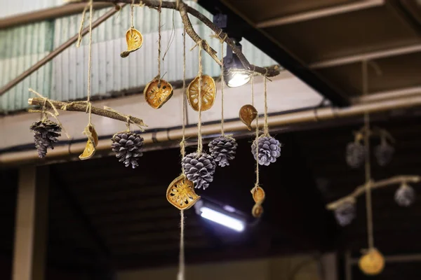 Dried pine cone mobile decorated in cafe — 图库照片