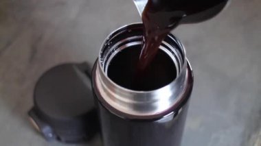 Handmade espresso coffee on eco-friendly reusable bottle, stock footage