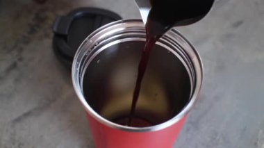 Handmade black coffee on eco-friendly reusable cup, stock footage
