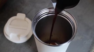 Handmade hot coffee on eco-friendly reusable cup, stock footage