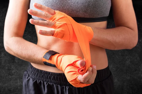 Female Hands Wearing Boxing Bandages