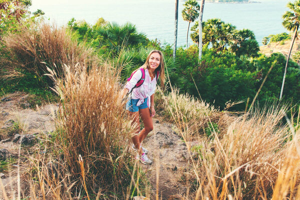 portrait happy travelling blonde girl island