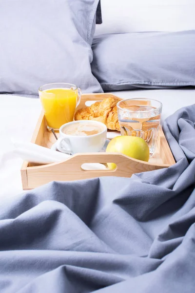 morning breakfast bed wooden tray coffee croissant