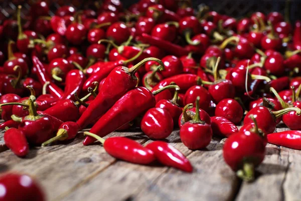 Red hot chili pepper scattered on wooden. Country — Stock Photo, Image