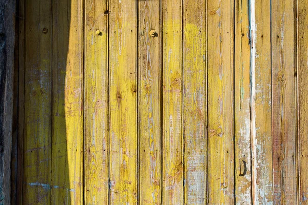Old shabby wooden planks with cracked color paint — Stockfoto