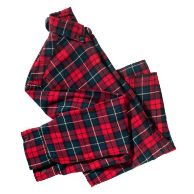 Kareli flanel gömlek beyaz üzerine katlanmış. Tekstil nesne giyer. Hava konseptinde uçmak