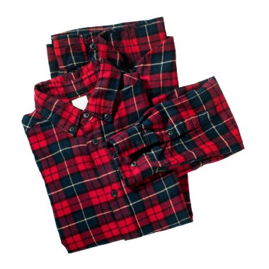 Kareli flanel gömlek beyaz üzerine katlanmış. Tekstil nesne giyer. Hava konseptinde uçmak