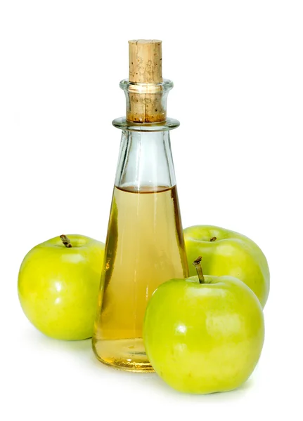 Apfelessig im Glasgefäß und grüne Äpfel — Stockfoto