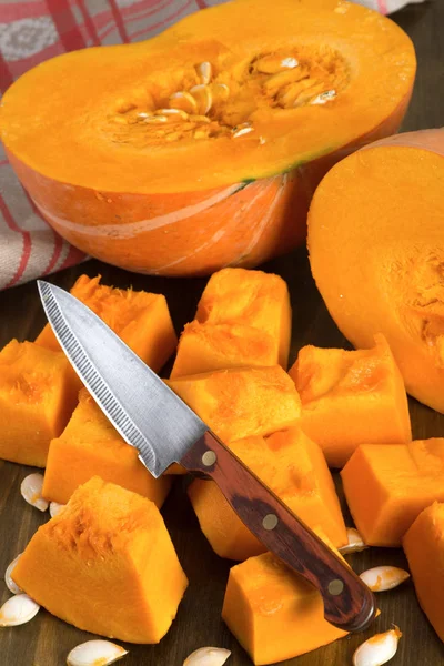 Ripe pumpkin cut into pieces — Stock Photo, Image