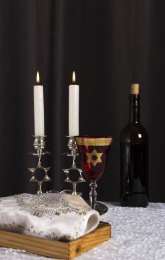 Shabbat Shalom - wine, challah and candles clipart