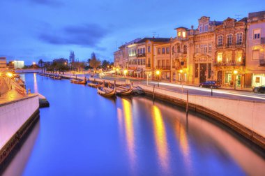 The Vouga river with traditional boats, Called Moliceiro, Aveiro clipart