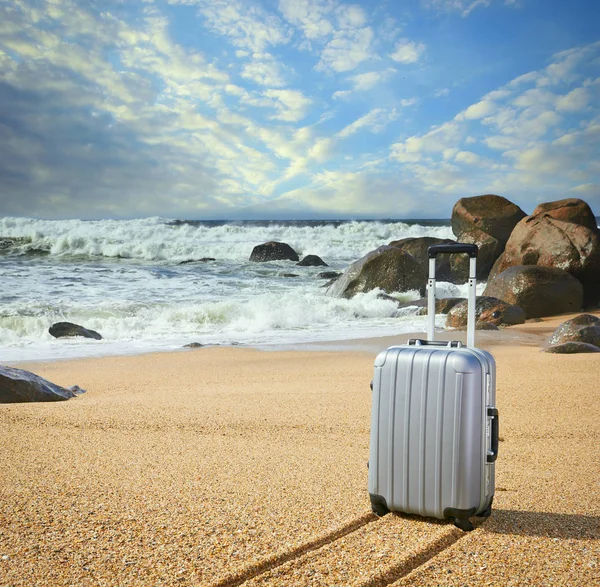 Suitcase on the beach with sand, summer sky — Stock Photo, Image