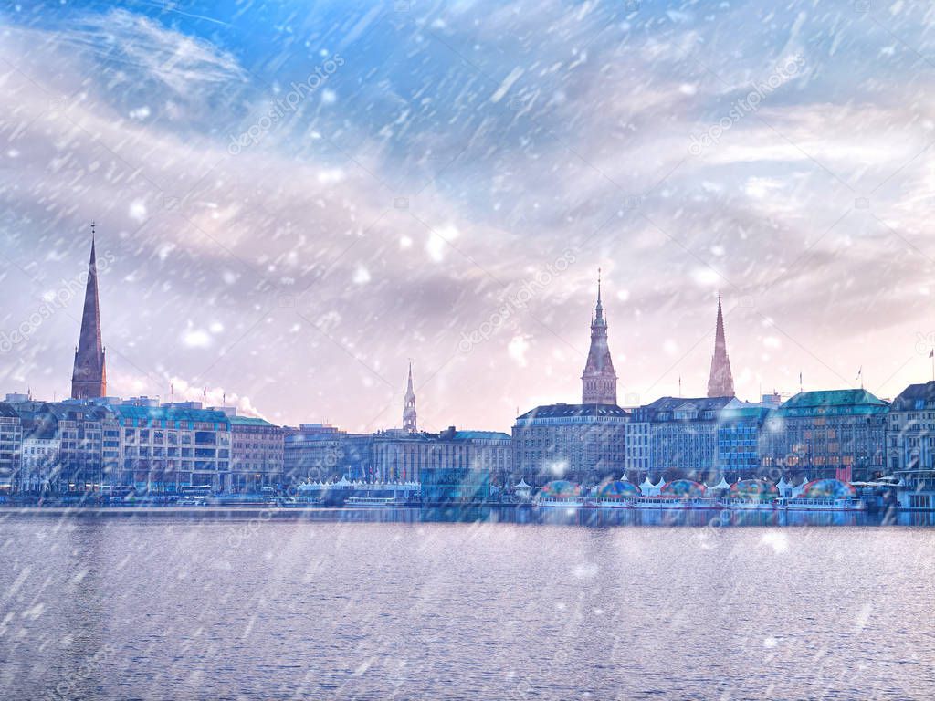 Winter snow town. Alster Lake and winter Hamburg cityscape