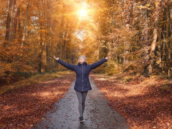 Freedom ideas concept, woman with raised hands up in forest — Stock Photo, Image