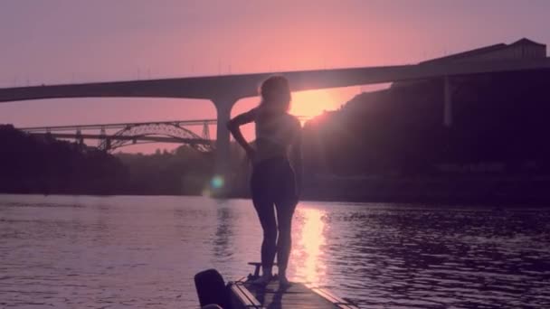 Young dancing woman on boat station, Porto in sunset — Stock Video