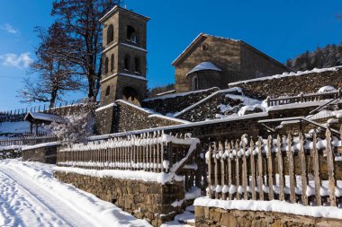 Old stone church, dedicated to Saint George in the village of Vovousa in Epirus, Greece in winter clipart