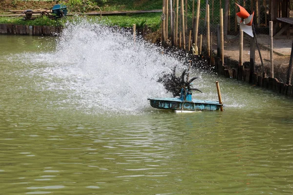 The Water turbine pump machine hit water on pool farm at thailand