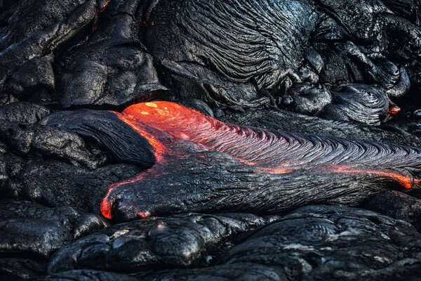 Lava Flowing in black rocks