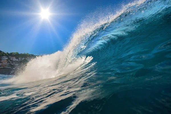 Ocean Wave under bright sun. Tropical sea water. Surfing swell with nobody