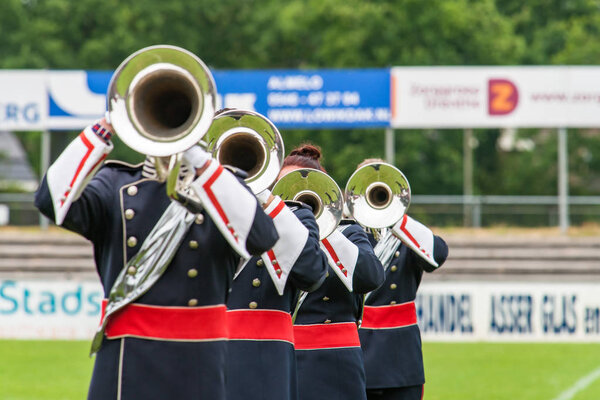 Brass band playing live music during performance